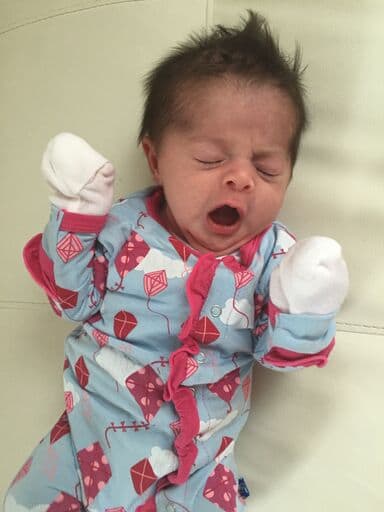  photo of newborn yawning