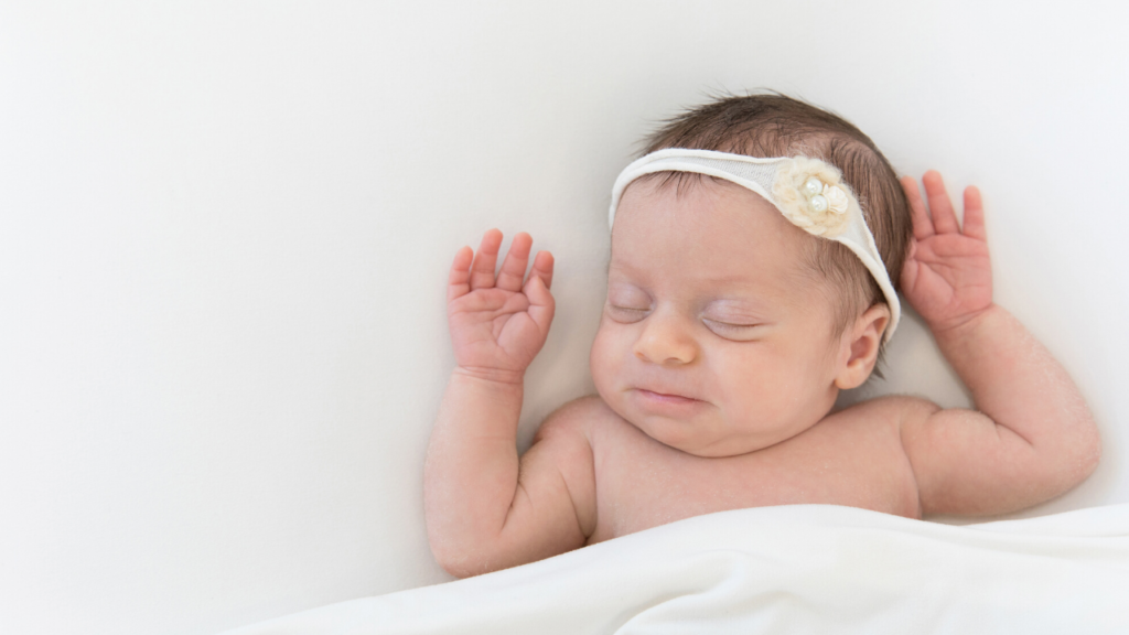 Larchmont, NY newborn and sibling photography session newborn in white headband