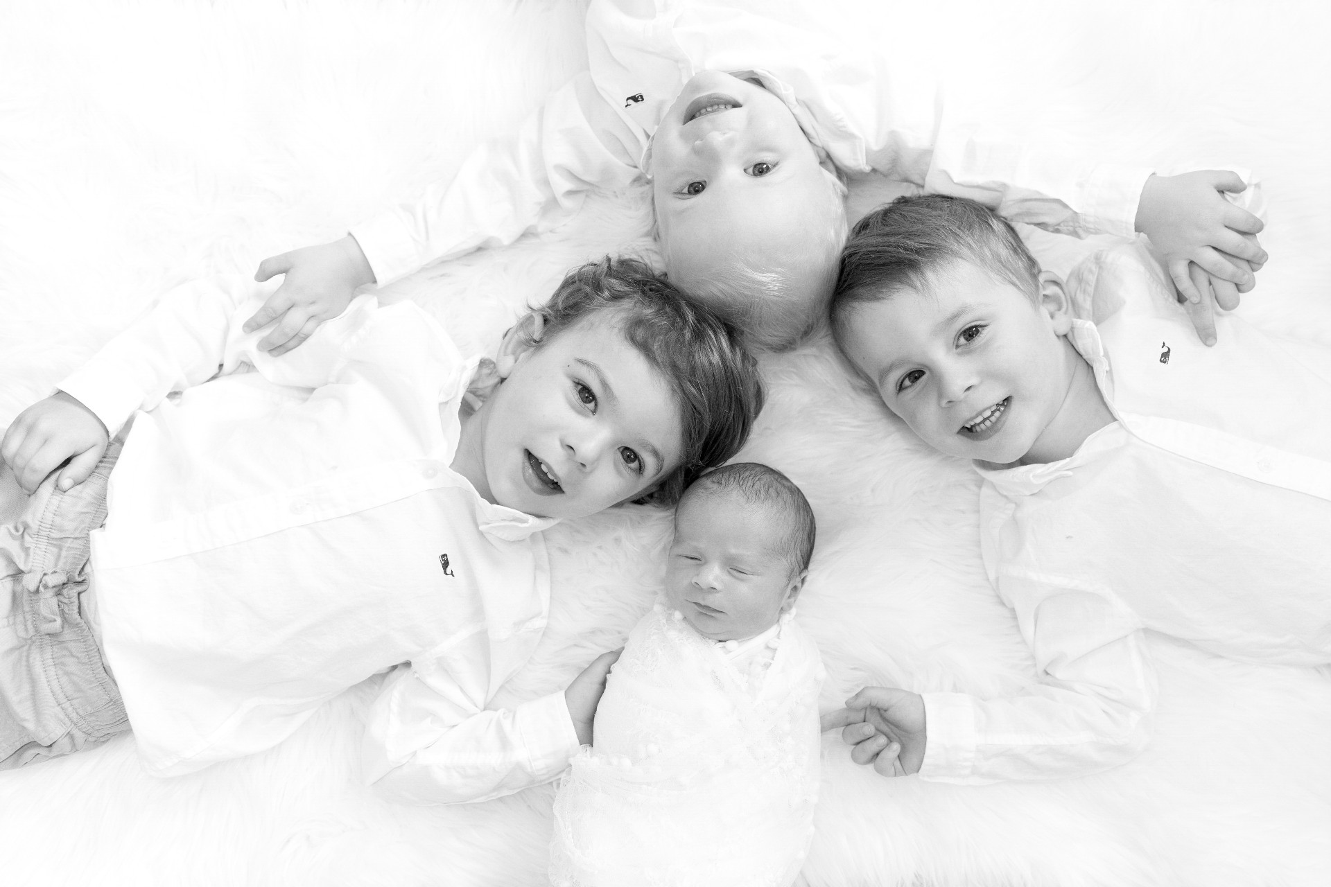 black and white newborn and sibling photo black and white family photography image Jane Goodrich newborn photographer in westchester