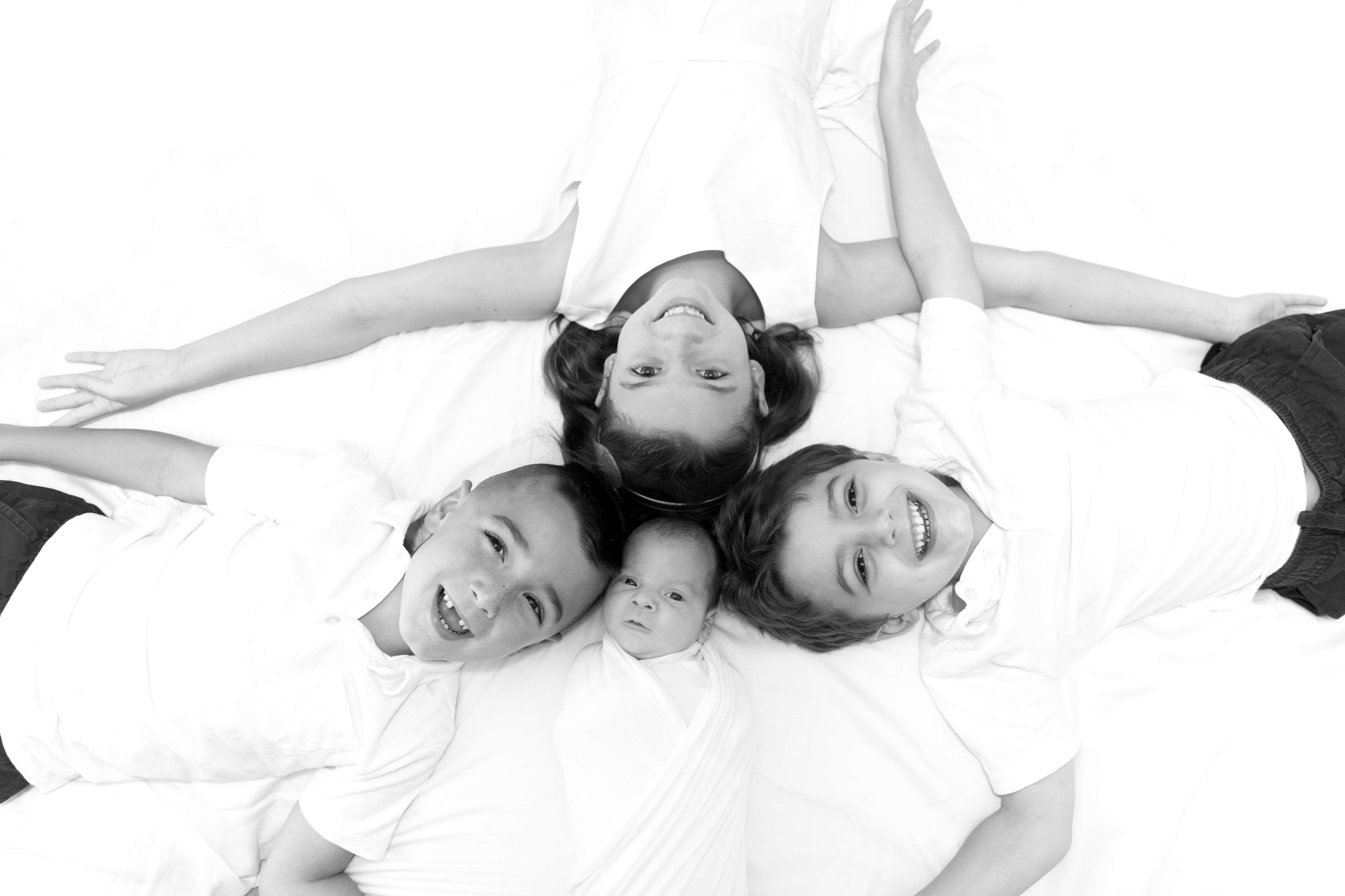 black and white newborn and sibling photo