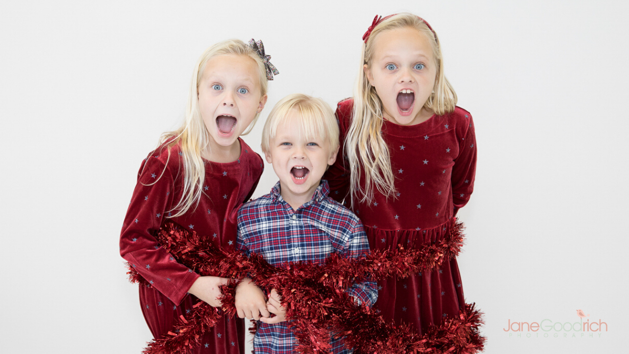 larchmont, family photography sessions ny happy funny holiday photograph sisters and brother garland