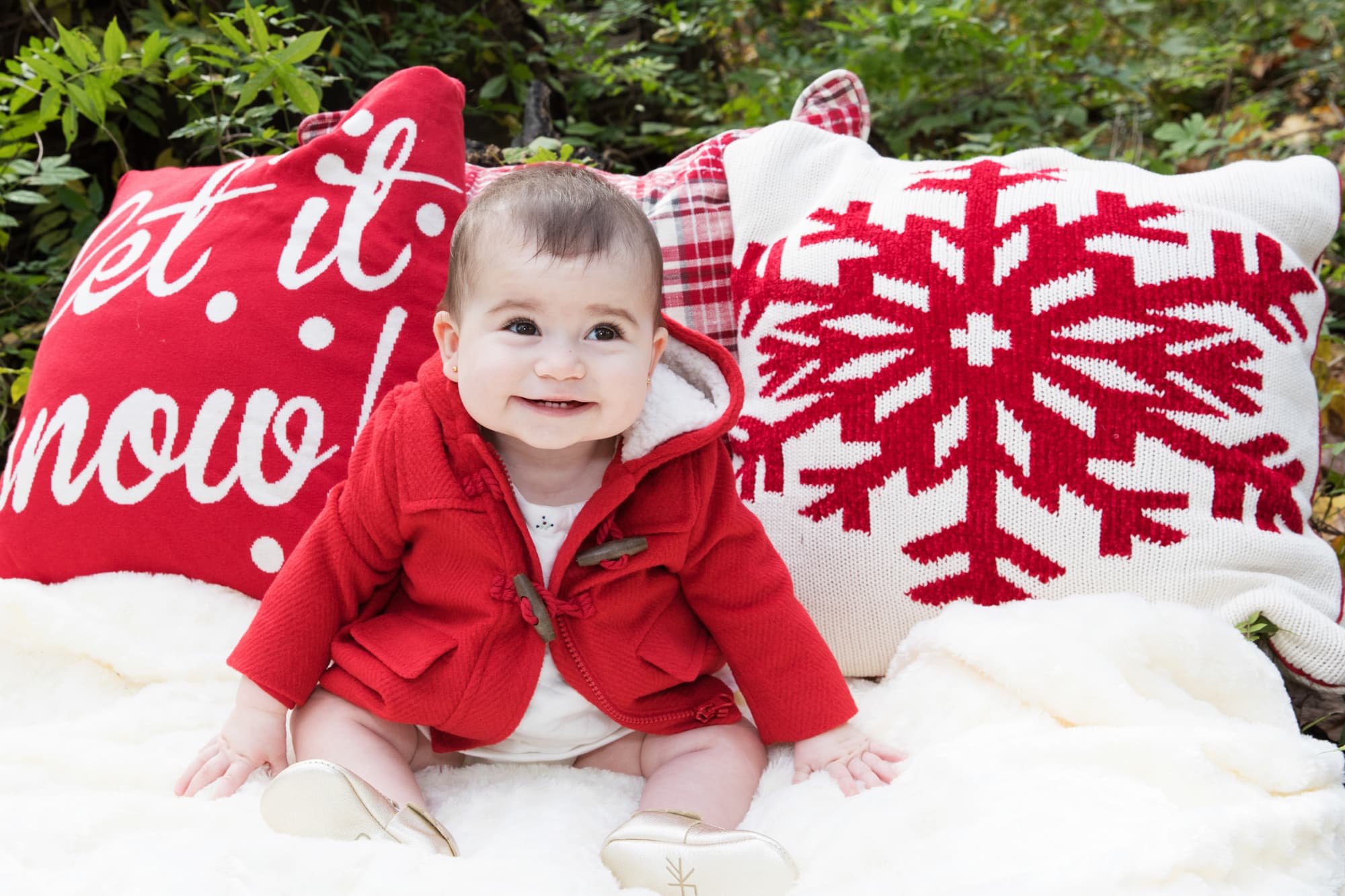 baby in red and white Christmas outfit portrait